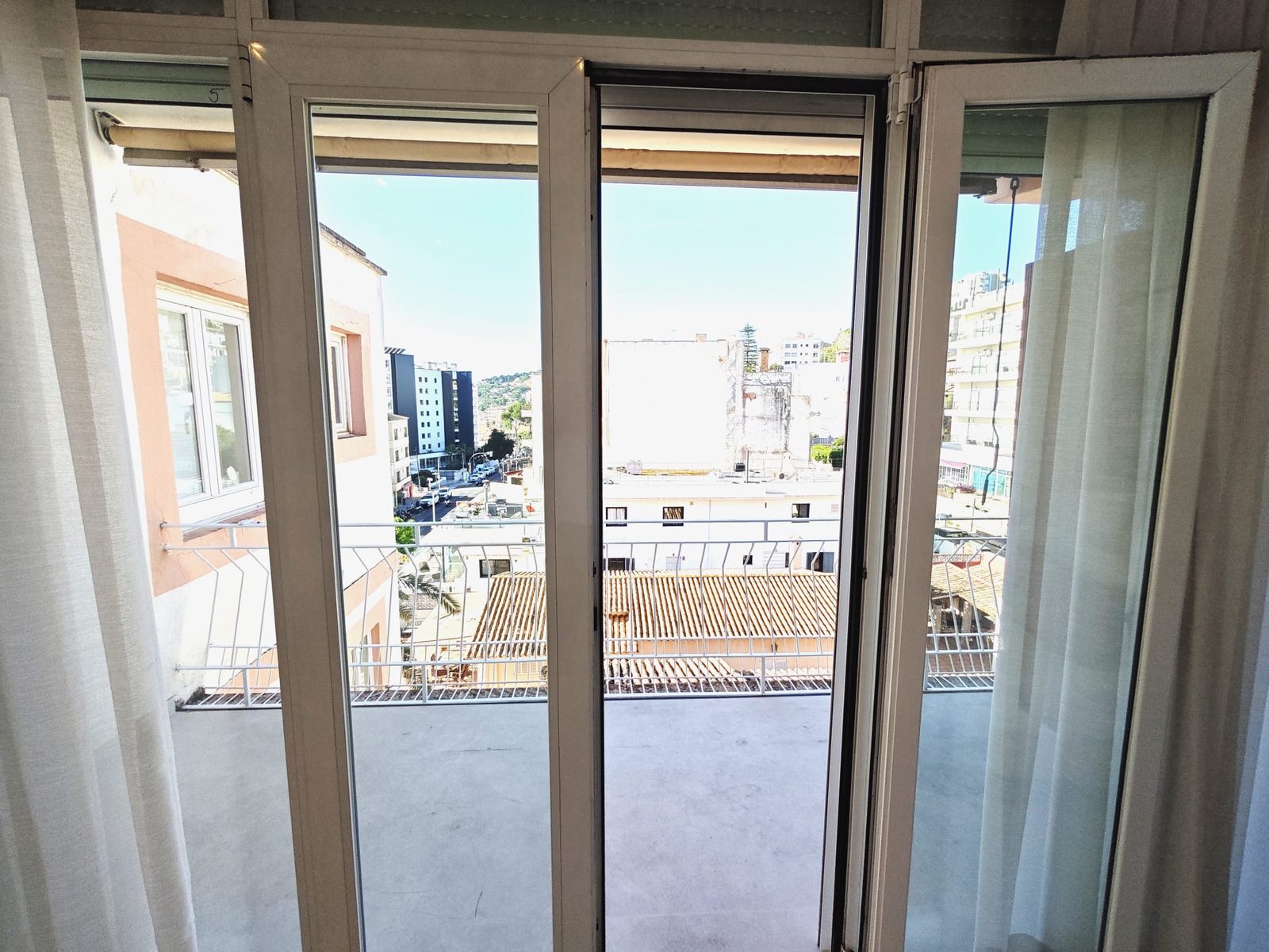 View through the balcony doors over Sant Agustí